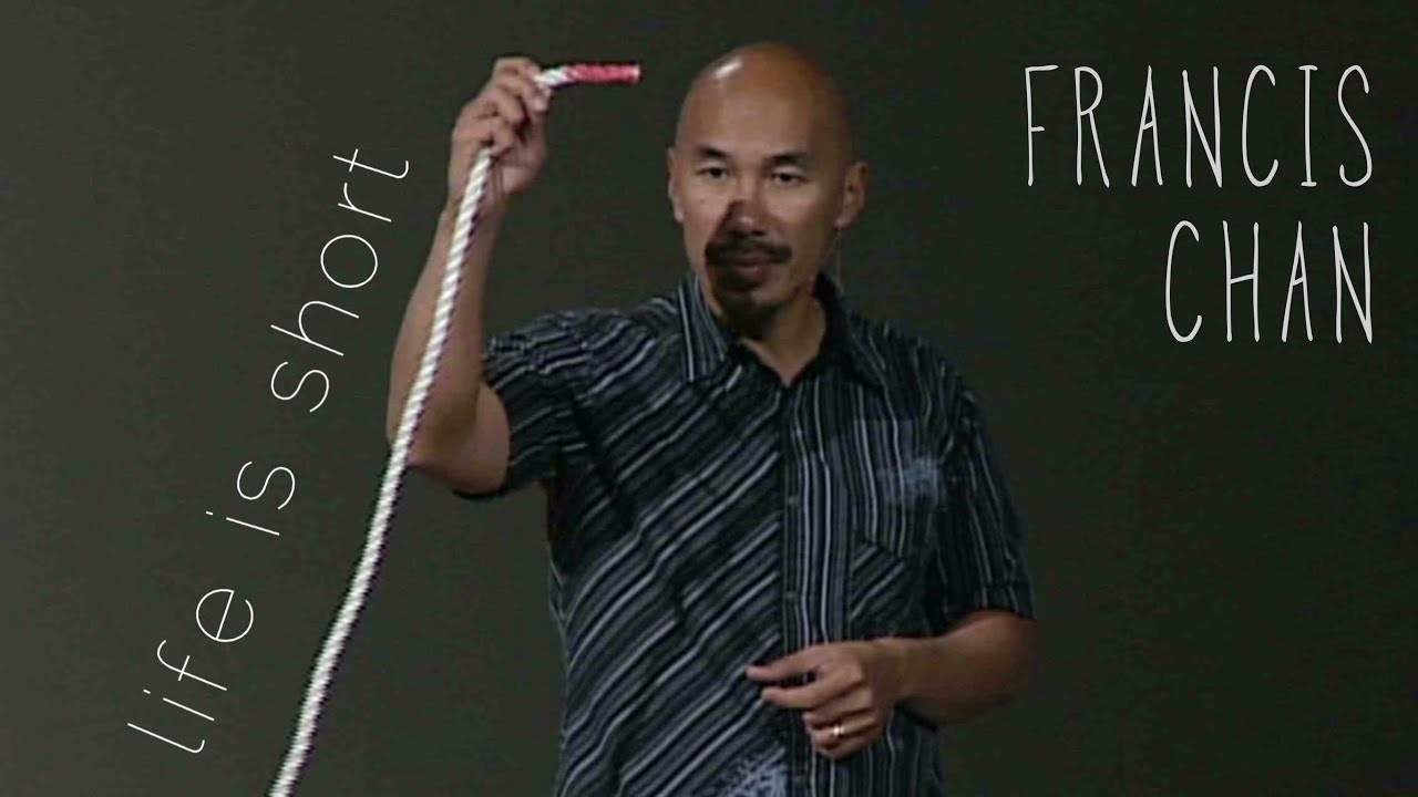 Francis Chan holds a rope against a dark background.